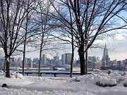 View of Empire State Building and Manhattan skyline from Hoboken, NJ over Hudson River.